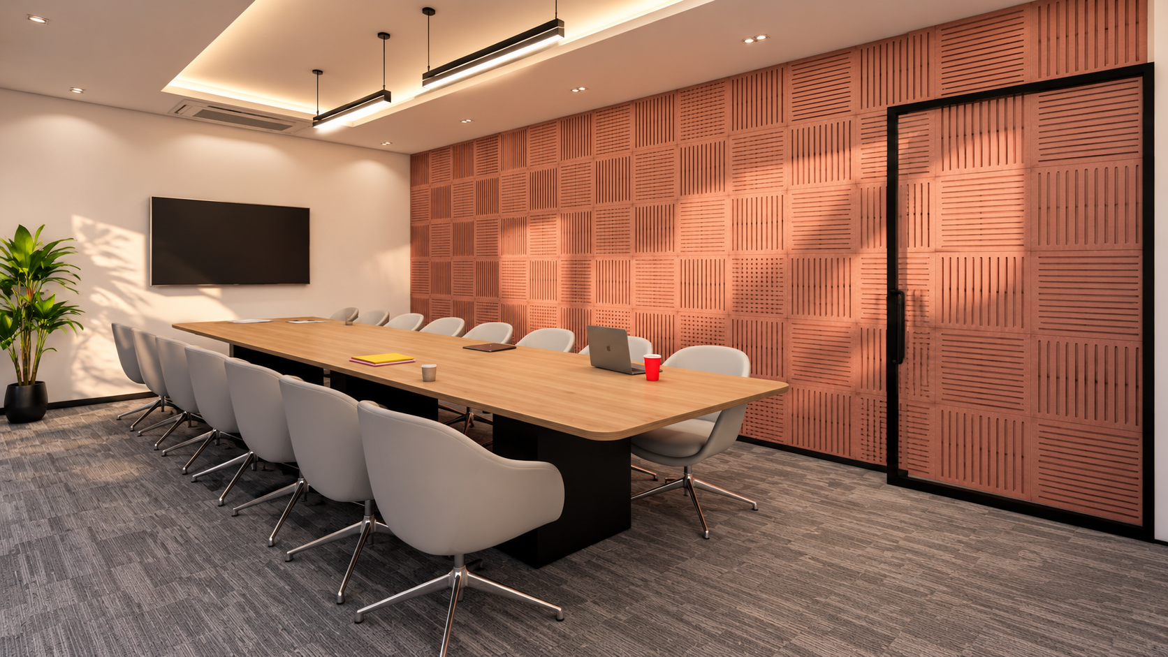 Conference room with a long table and display screen